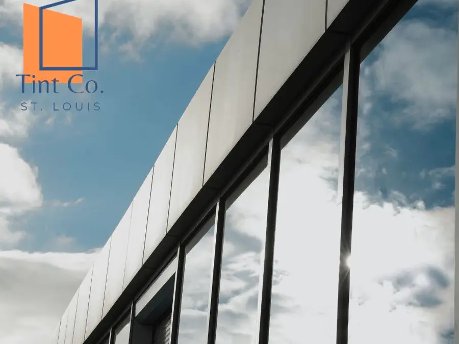 Commercial building glass treated with solar control window film